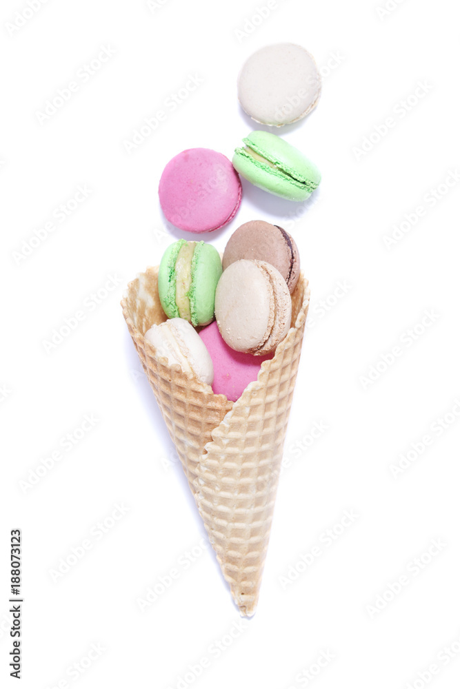 macaroons in a waffle cone on white background.