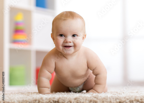 crawling baby boy weared in...