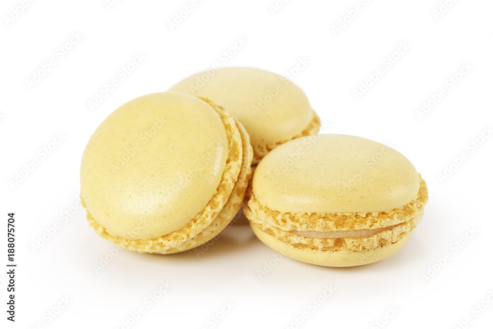 three yellow lemon macarons isolated on white three yellow lemon macarons isolated on white