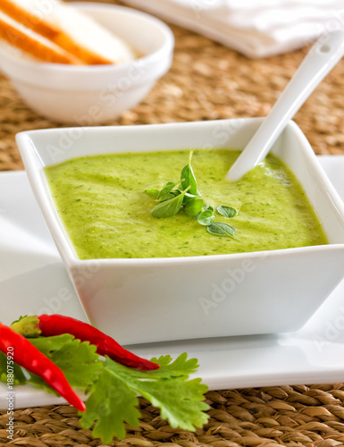 Green spicy sauce called mojo verde. photo
