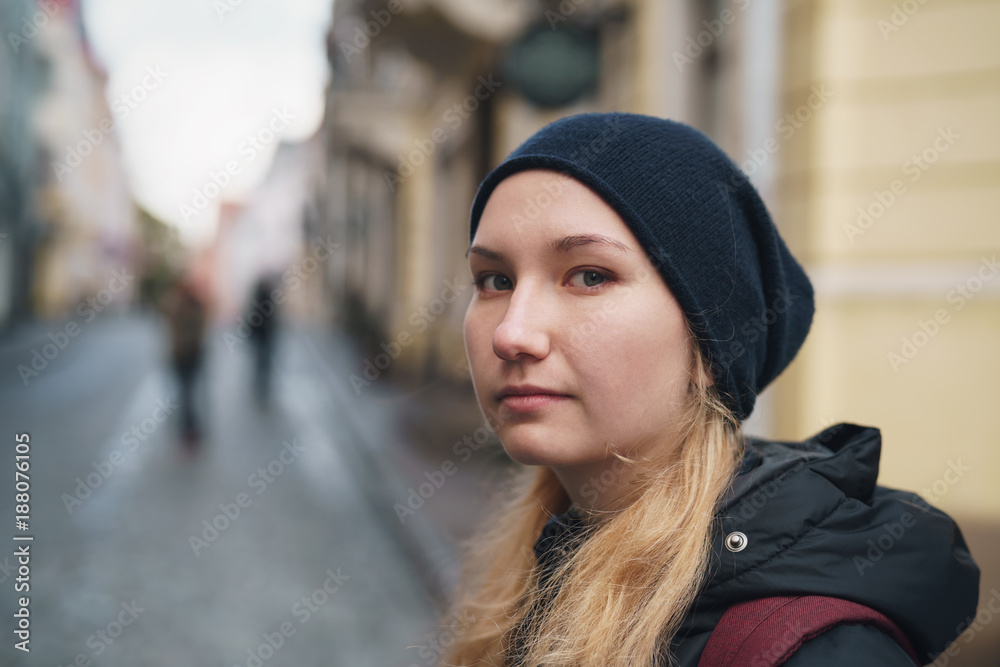 portrait of teen girl walking in Old Tallinn in autumn portrait of teen girl walking in Old Tallinn in autumn
