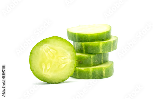 Closeup Slices of green cucumber isolated on white background . © oatautta