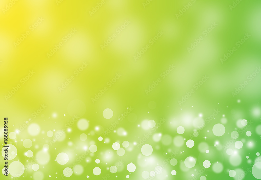 Green and Yellow glitter sparkles rays lights bokeh festive elegant abstract background.