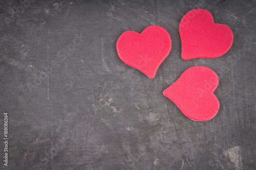 Pink hearts on a gray background. The symbol of the day of lovers. Valentine's Day. Concept February 14.