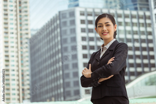 Asian smart business girl with outdoor building background