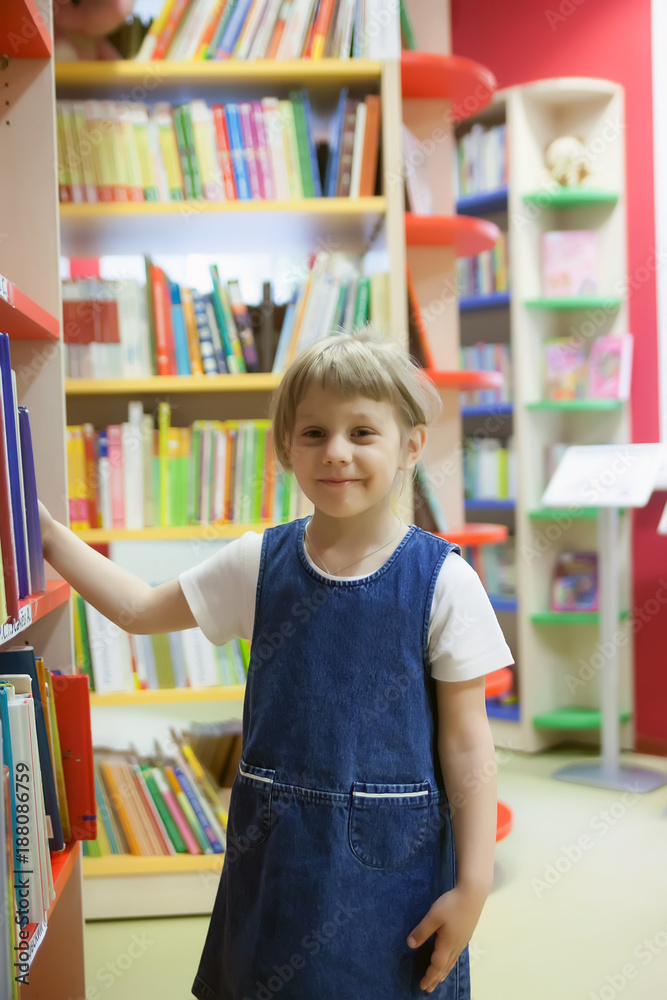 girl between shelves in library. girl between shelves in library.