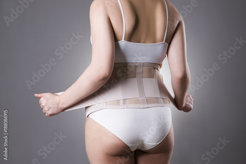 Obraz na płótnie Pregnant woman with orthopedic support belt