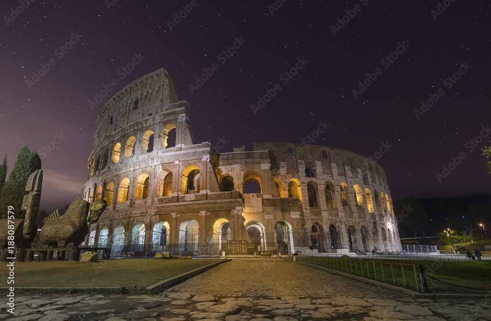 Beautiful night view with stars of Colosseum in Rome, Italy