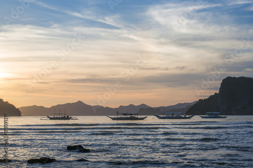 Bangka boats view at beautiful sunset on El Nido bay, Palawan island, Philippines © Alexey Pelikh