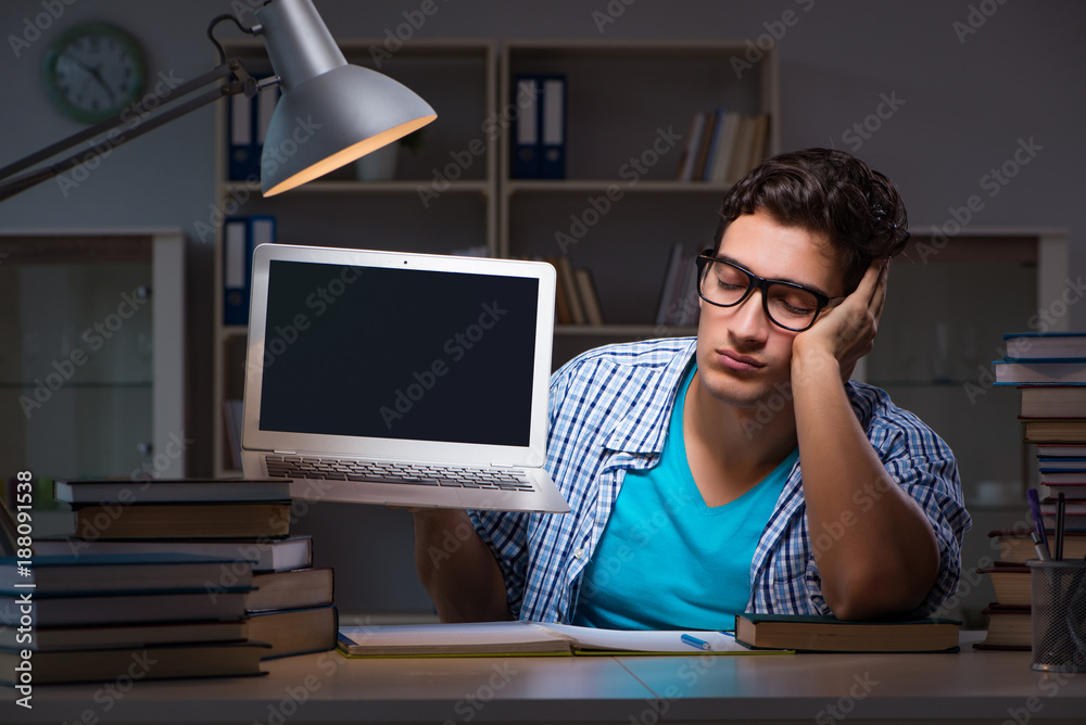 Student preparing for exams late night at home Student preparing for exams late night at home