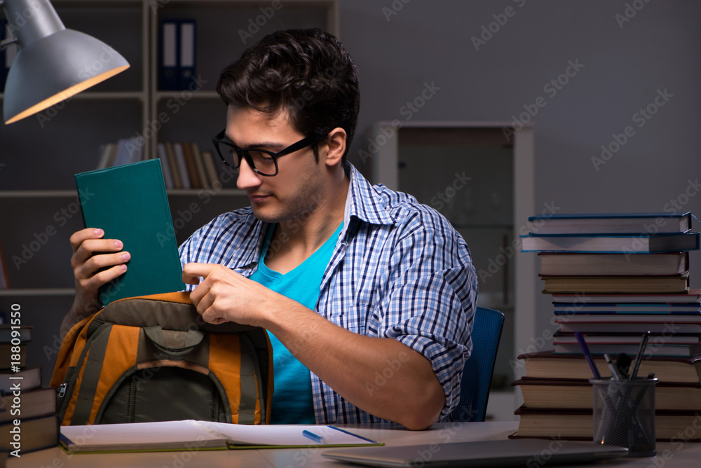 Student preparing for exams late night at home Student preparing for exams late night at home