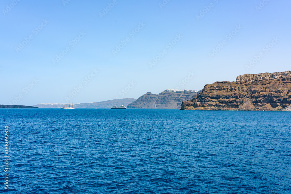 Boats with tourists near Santorini islands. Greece in summer. Boats with tourists near Santorini islands. Greece in summer.