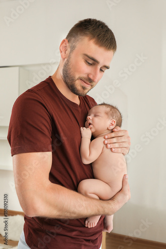 Father with cute little baby at home © Africa Studio