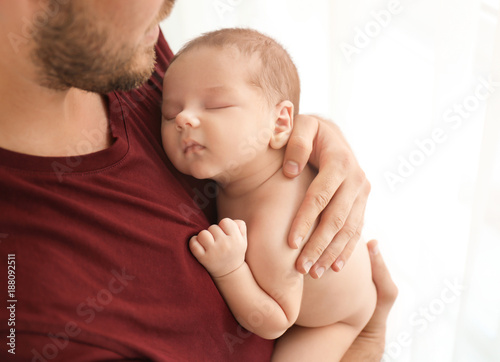 Father with cute little bab...