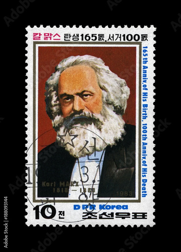 Karl Marx, famous politician leader, Capital - Critique of Political Economy book author, circa 1983. Vintage postal stamp of DPR Korea isolated on black background.