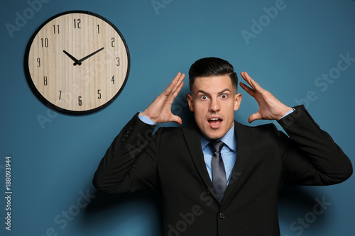 Shocked manager near wall w...
