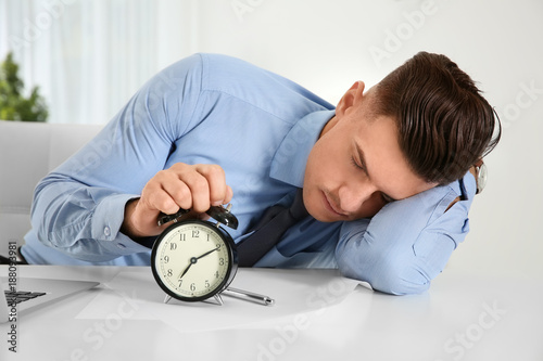 Tired manager with alarm cl...