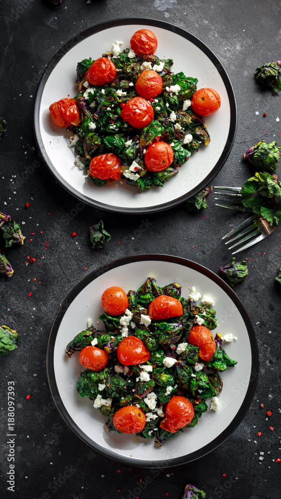 Homemade Roasted Green Kalettes salad with cherry tomatoes and feta cheese. healthy food Homemade Roasted Green Kalettes salad with cherry tomatoes and feta cheese. healthy food