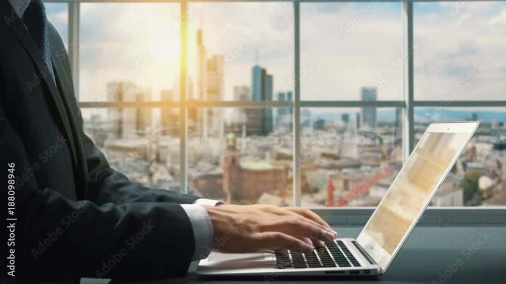 View of Frankfurt Germany.Close up hand Businessman using laptop View of Frankfurt Germany.Close up hand Businessman using laptop