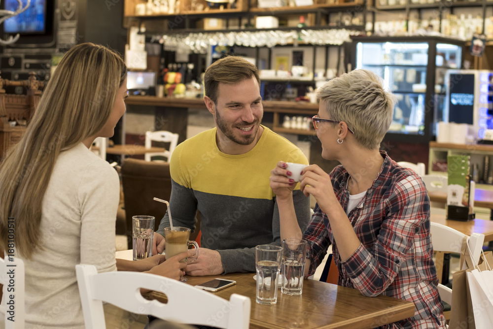 Friends having a great time in a coffee shop. Friends having a great time in a coffee shop.