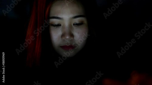 Beautiful woman using laptop and smiling in content 