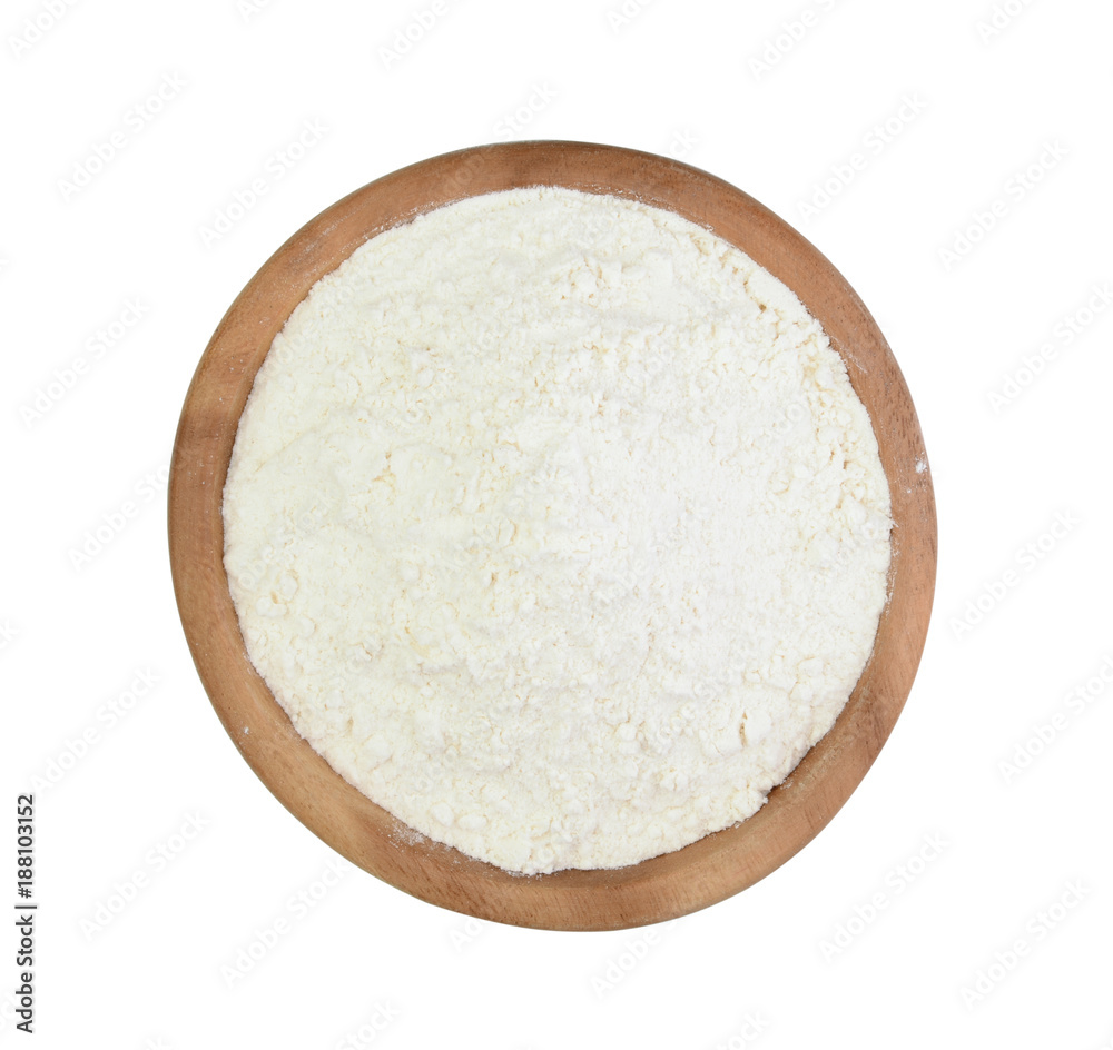 Wheat flour in a wooden cup isolated Wheat flour in a wooden cup isolated