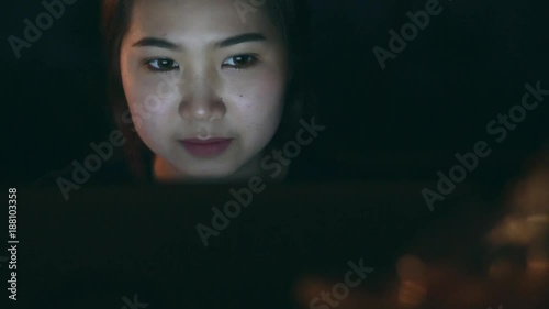 Beautiful woman using laptop and smiling in content 