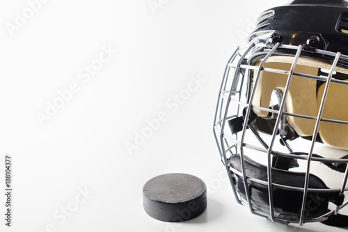 Canvas Print Ice hockey helmet and puck