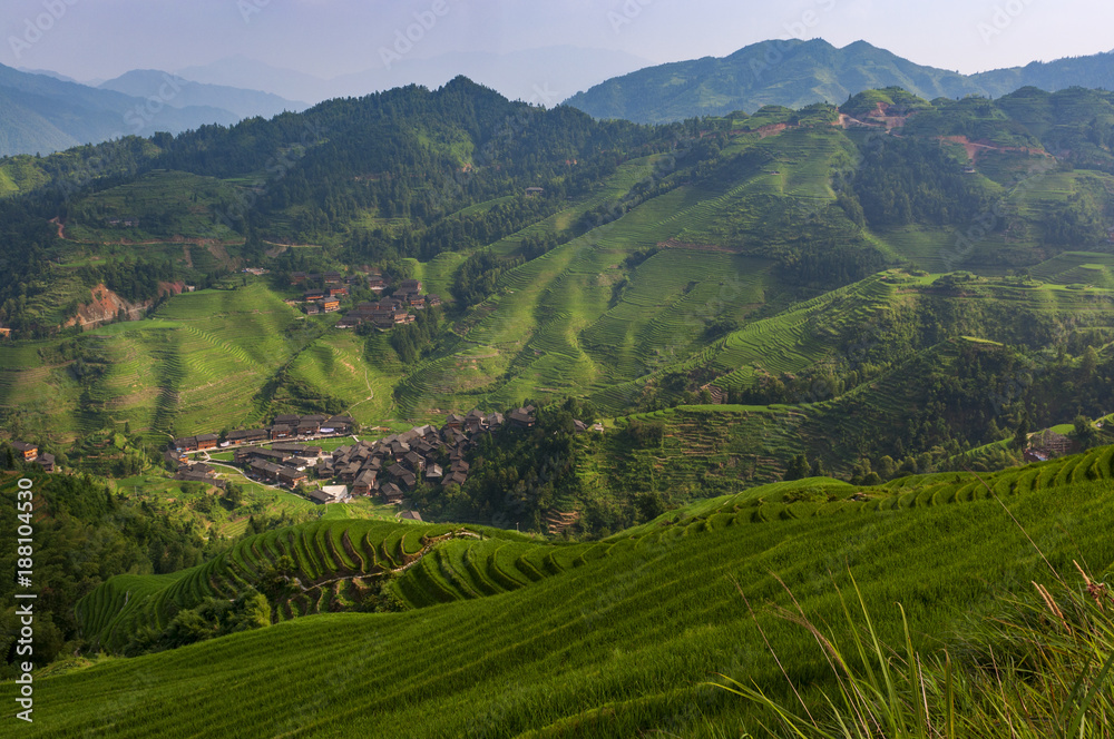 Beautiful view of the Dazhai village and the surrounding Longsheng Rice Terraces in the province of Guangxi in China; Concept for travel in China
