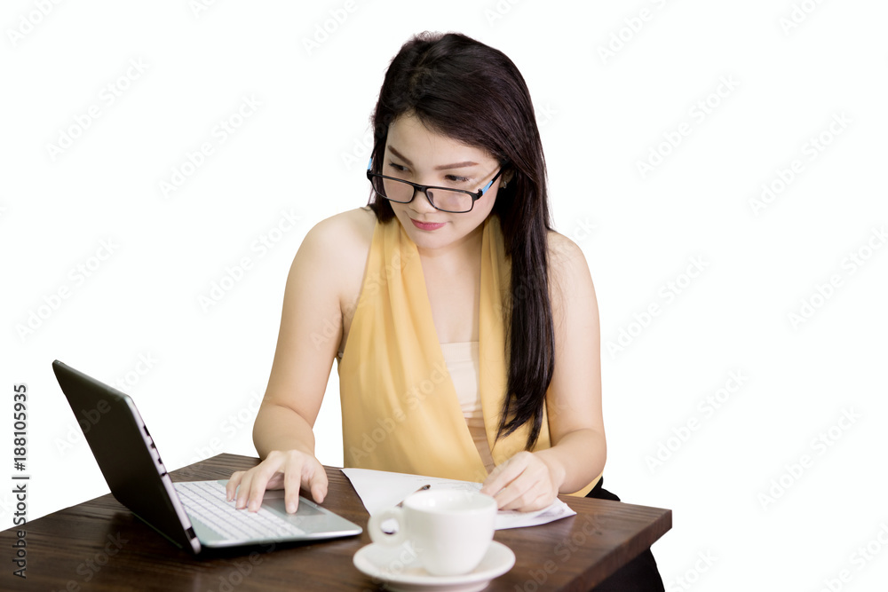 Beautiful businesswoman typing on the laptop Beautiful businesswoman typing on the laptop