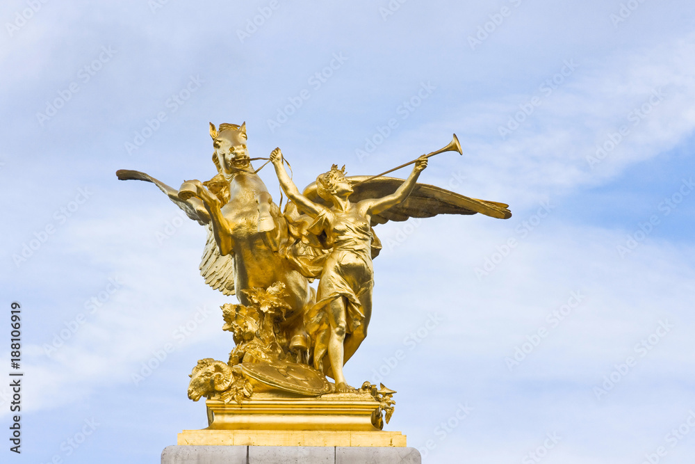 Fototapeta premium Sculpture detail of Fame restraining Pegasus on Pont Alexandre III bridge in Paris France 
