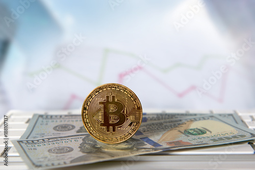 Bitcoin golden coin with financial chart and dollar background