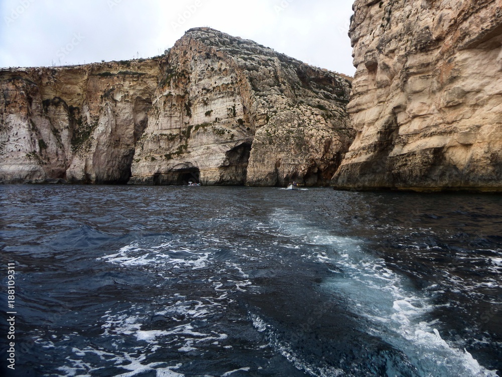 view on cliffs from boat on sea 