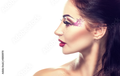 Portrait of a beautiful woman with long eyelashes and beautiful make-up in a beauty salon. © Dimid