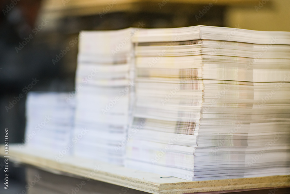 High Contrast, Stack of Printed Paper. Industry Offset Sheets in printing factory. High Contrast, Stack of Printed Paper. Industry Offset Sheets in printing factory.
