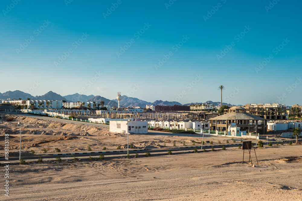 Fragment of the city of Sharm El Sheikh on the background of the Sinai mountains at sunset