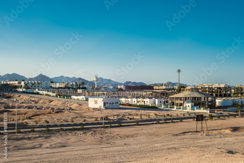 Fragment of the city of Sharm El Sheikh on the background of the Sinai mountains at sunset