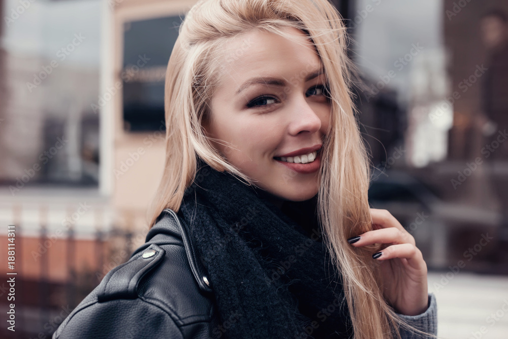 Beautiful blond woman portrait.Close-up Fashion woman portrait of young pretty trendy girl posing at the city, autumn street fashion. laughing and smiling portrait.trendy.Spring urban outfit.