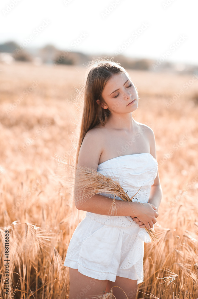 Young Beautiful Teen Girl 14-16 Year Old Posing In Apple Orchard. Wearing  White Elegant Dress. Summer Time. Stock Photo, Picture and Royalty Free  Image. Image 77590954.