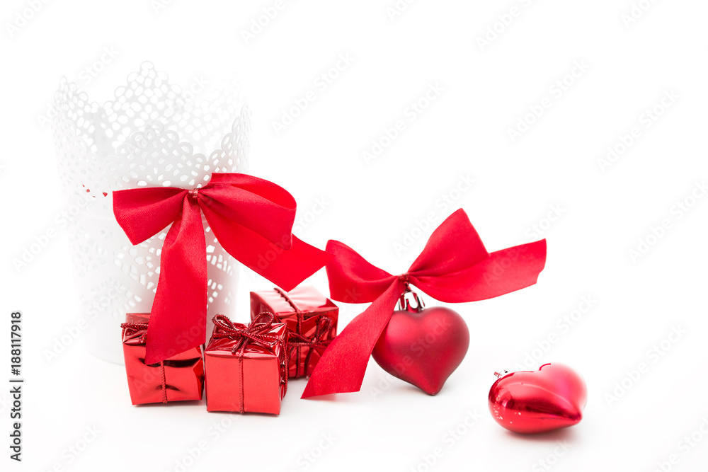 gifts in a white basket with a heart with a bow in red on a white background gifts in a white basket with a heart with a bow in red on a white background