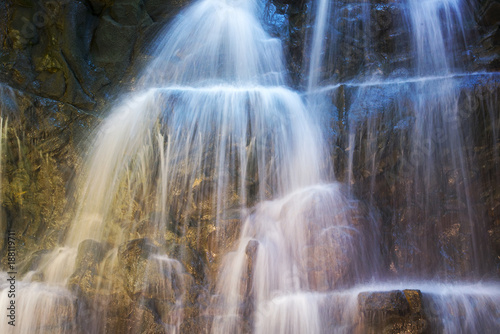 Close-up waterfall in a cave, wild landscape