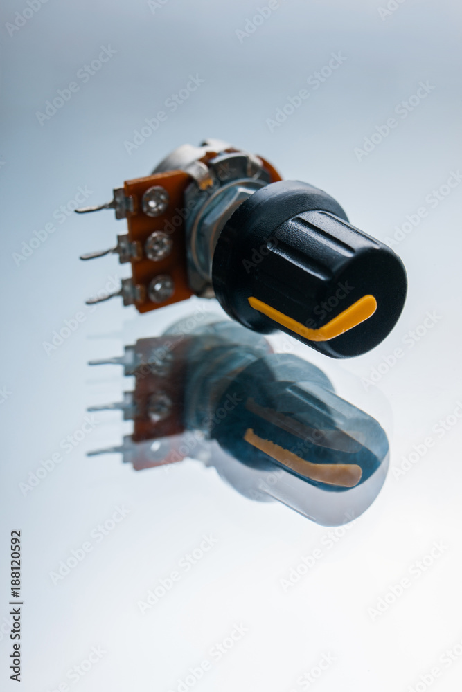 variable resistor on a white background. apparatus regulating the