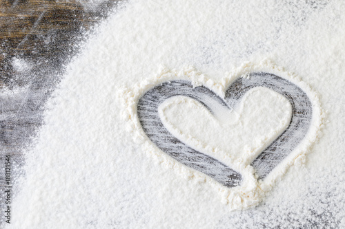 heart from flour on the table