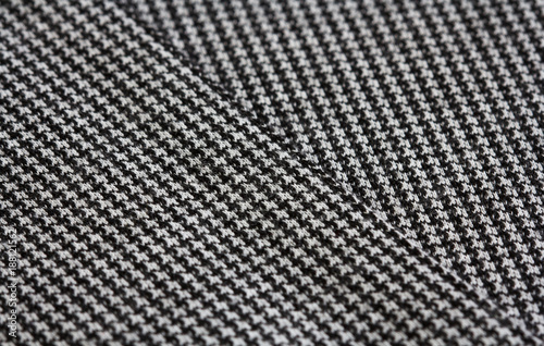 fabric texture with crow's feet pattern, knitted background