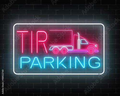 Neon glowing TIR parking sign on a brick wall background. Glow signboard of a long vehicle truck and truckers.