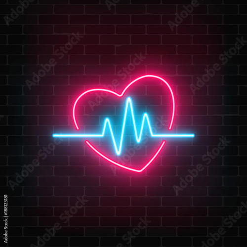 Glowing neon medicine concept sign with cardiogram graph in heart shape on a brick wall background.