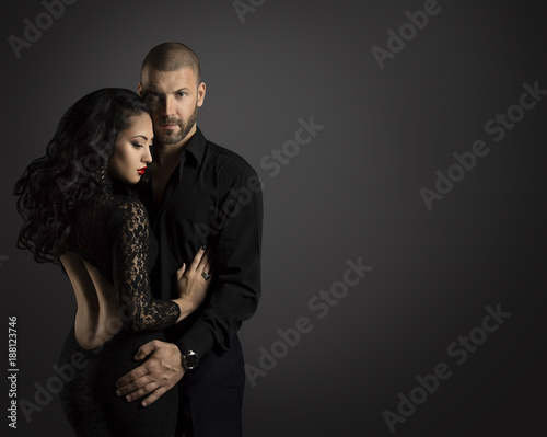Couple Fashion Portrait, Young Man Embrace Beautiful Woman in Elegant Black Dress