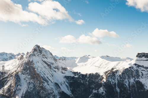 Snow-covered Dolomite Alps at winter sunny day  Val di Fassa ski resort  Italy