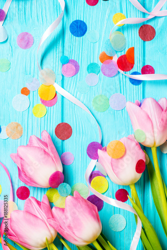 Wooden mint background and pink tulips