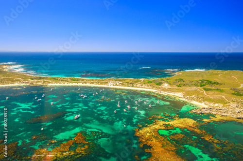 Aerial view of Narrow Neck, Rocky Bay beach and Strickland Bay in Rottnest Island, Australia. Scenic flight over famous tourist destination of Western Australia. Indian Ocean with reef. Copy space. © bennymarty